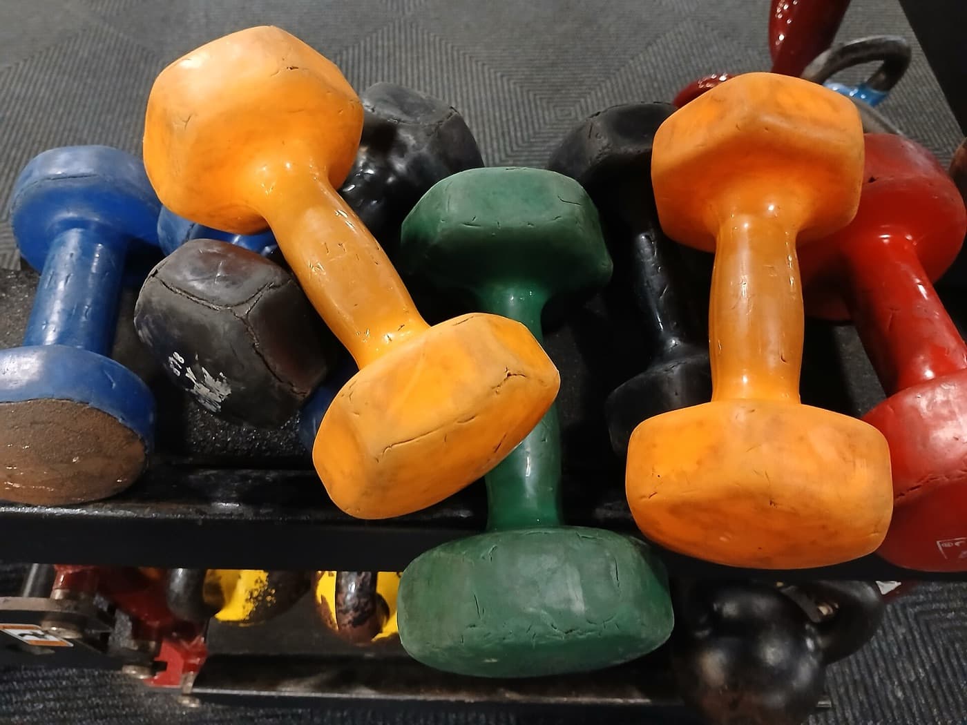 A pile of colorful dumbbells